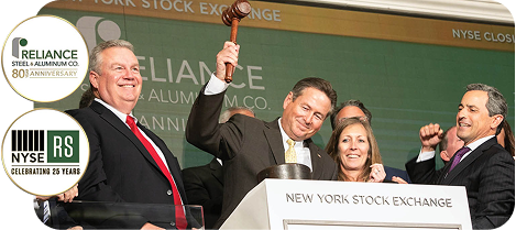 Executives celebrating at the New York Stock Exchange during a Reliance Steel anniversary and NYSE milestone event