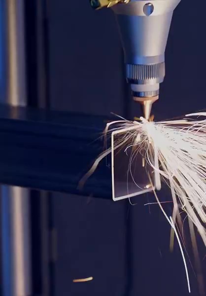 Machine working on a metal square tube